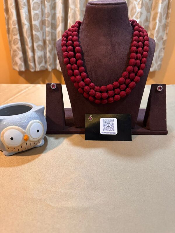 Maroon Coloured Multi Layered Fabric Necklace with AD stone Earrings